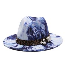 Our selection of fedora hats comes in several patterns, suitable for a range of styles and preferences. Each hat boasts a timeless fedora silhouette with a wide brim and indented crown, complemented by a tasteful band detail. Whether you choose a hat with a vibrant, multicoloured pattern for a statement piece or prefer a more subtle, monochromatic design for a refined look, these hats are versatile enough to enhance any ensemble. Perfect for any season, they can transition effortlessly from casu Trendy Short Brim Felt Hat For Festivals, Western Fedora Top Hat For Summer, Western Style Fedora Top Hat For Summer, Trendy Curved Brim Felt Hat For Festivals, Adjustable Flat Brim Felt Hat For Summer, Trendy Wide Brim Felt Hat For Festivals, Summer Adjustable Felt Hat With Flat Brim, Summer Felt Hat With Adjustable Flat Brim, Western Style Felt Hat For Beach In Summer