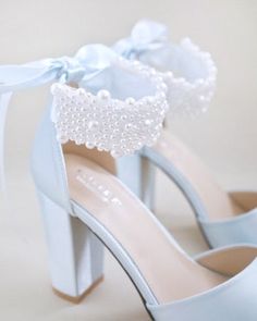 Satin block heel wedding sandals adorned with all over pearls ribbon strap . Elegance and feminine inspired wear for your special day. The delicate pearl beads are placed to create a graceful classic style. Simple and easy wear for bridal wear, bridesmaids, holiday party, wedding parties, and any special occasions. The light blue color can easily be your something blue.DETAILS:HEELS: 4 inchesCOLORS AVAILABLE: Ivory, White and Light BlueUPPER: Synthetic upper and liningMATERIALS: Manmade outsoleO Mid Calf Dresses, Bridal Sandals, Purple Wine, Drawstring Dresses, Christmas Gift Shop, Wedding Sandals, Wedding Parties, Bride Shoes, Boot Pumps