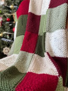 a blanket is draped over a christmas tree