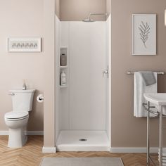 a white toilet sitting next to a shower in a bathroom on top of a hard wood floor