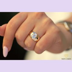 a woman's hand with a ring on it