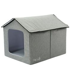 a gray dog house that has the door open and it's inside is shown