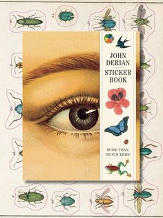 the john derian sticker book is open to reveal an image of a woman's eye