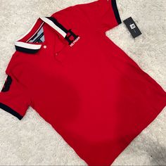 Tommy Hilfiger Red Polo Shirt Red Sporty Polo Collar Top, Sporty Red Polo Collar Top, Sporty Red Top With Polo Collar, Red Polo Collar T-shirt For Summer, Sporty Red Short Sleeve Polo Shirt, Red Collared Sporty Shirt, Sporty Red Collared T-shirt, Tommy Hilfiger Red Short Sleeve Top, Tommy Hilfiger Red Cotton Shirt