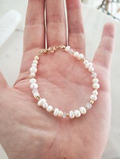 * This dainty bracelet is perfect for a wedding or layered with bangles! Dress it up or down. * Genuine freshwater pearls are arranged thoughtfully among 14k gold filled beads, and faceted rainbow moonstone. No one of these bracelets will be exactly the same, making each one unique 💫 * Secure with all 14k gold filled findings and easy to use lobster clasp. * Made from top quality materials, gold fill won't tarnish or turn, wear 24/7. **Pro tip** For measuring your wrist- If you don't have a fle Everyday 14k Gold Filled Bracelets With Pearl Charm, Everyday 14k Gold-filled Bracelets With Pearl Charm, Everyday 14k Gold-filled Bracelet With Pearl Charm, Handmade Dainty Pearl White Bracelets, Handmade Delicate Pearl Bracelets, Delicate Handmade Pearl Bracelets, Pearl Bracelets With Tiny Beads For Wedding, White Tiny Beads Bracelets For Wedding, White Tiny Beads Bracelet For Wedding