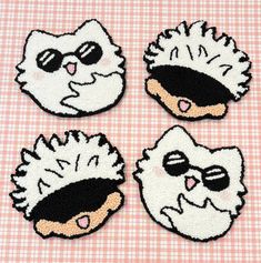 three embroidered patches depicting cats wearing sunglasses