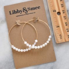 With white moonstone beads (that are said to be a feminine and sensual gemstone) these hoops will give you all the girl power vibes you need. 45mm (about 1.75") gold-filled or sterling silver hoops with White Moonstone gemstone beads packaged on a kraft earring card in a clear resealing bag gold-filled hoops are lead-free gold over brass. Gold-filled has much more gold than gold-plated and will last longer without tarnishing. Not sure which gemstone to choose? This blog post might help: Get Your Hoop Earring Diy, White 14k Gold Filled Hoop Earrings, White 14k Gold Filled Hoop Jewelry, Handmade White 14k Gold Filled Hoop Earrings, Handmade 14k Gold Filled White Hoop Earrings, White Hypoallergenic Small Hoop Earrings, Nickel Free White Circle Hoop Earrings, Nickel-free White Circle Hoop Earrings, Adjustable White Hoop Earrings With Ear Wire