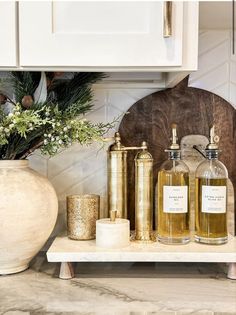 some bottles and candles on a counter in a kitchen