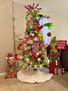 a decorated christmas tree in the corner of a room