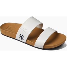 Enjoy a fun day under the sun in these Cushion Vista sandals from REEF. Designed with subtle yet striking New York Yankees details, these slides are perfect for poolside fun or game day festivities. The contoured footbed maximizes comfort, helping you feel your best as you rep the New York Yankees.Enjoy a fun day under the sun in these Cushion Vista sandals from REEF. Designed with subtle yet striking New York Yankees details, these slides are perfect for poolside fun or game day festivities. Th Adjustable Summer Sport Sandals, Synthetic Slide Flip Flops For Summer, Adjustable White Synthetic Slides, White Synthetic Sandals For Pool, White Synthetic Sandals For The Pool, White Open Toe Flip Flops For Pool, White Synthetic Sandals For Beach Season, Sporty Sandals For Summer Pool Activities, Synthetic Slide Sandals For Swimming