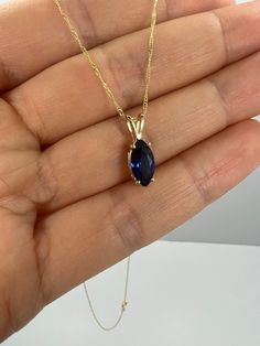 This is a beautiful pendant design. It is set in real solid 14Kt Gold and the chain is 14Kt Gold as well. I have this pendant available with all gemstones that you can see in my store. You can choose if you want 14Kt White Gold, 14Kt Yellow Gold or 14Kt Rose Gold. This is the perfect gift for mom, wife, fiancee, girlfriend, valentine, daughter, family or friend. It is a special gift for mother's day, valentine's day, wedding, anniversary, birthday, Christmas, Easter, New Year's and any holiday. Blue Oval Pendant Necklace With Diamond Cut, Blue Marquise Necklace For A Gift, Blue Marquise Necklace For Gift, Blue Teardrop 14k Gold Necklace, Dark Blue Jewelry, Marquise Necklace, September Birthstone Necklace, Necklace Sapphire, Blue Sapphire Necklace