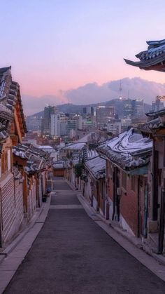 an alley way with buildings in the background and a quote on it that says stop searching for someone else