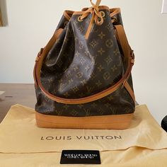 Vintage Louis Vuitton Noe Bag. This Is Vintage Bag From 1995 And Does Not Have The Tag Inside The Bag. However It Does Have Proof Of Authenticity With The Card From What Goes Around Comes Around. There Are Some Water Stains On The Bottom Of The Bag And Around The Top Edge. Nothing Super Noticeable Unless You Really Look For It. Otherwise In Great Condition. The Shoulder Strap Is Perfect. Stored In The Cloth Bag (And I Have Never Used It). Date Code Ar0925 - Last Picture. (I Had To Watch A Video Designer Brown Bag With Original Box, Everyday Luxury Monogram Canvas Bag With Branded Hardware, Designer Everyday Bag In Signature Coated Canvas, Designer Monogram Canvas Bucket Satchel Bag, Designer Monogram Canvas Shoulder Bag For Everyday Luxury, Modern Everyday Luxury Bag In Monogram Canvas, Modern Monogram Canvas Bag For Everyday Luxury, Designer Pre-owned Shoulder Bag, Designer Coated Canvas Satchel Bucket Bag