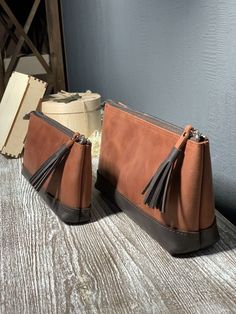 Leather pencil case is a wonderful bridesmaid gift. We can make personalization and put initials or any text you desire to see) There are two sizes of this leather pen pouch Bigger size 22x12x6 cm (8.7x4.7x2.4 inch) Smaller size 18x10x4 cm (7x5x1.6 inch) This leather pencil case has a pocket inside. Can be also used as a makeup bag or toiletry bag. It is made in combination of two colors - cognac brown and dark brown. You can order your own combination and create a unique product, just contact m Brown Pouch Pencil Case For Personal Use, Leather Pencil Case Pouch For Personal Use, Brown Zipper Pouch Pencil Case For Personal Use, Brown Leather Pencil Case Gift, Brown Leather Pencil Case For Daily Use, Brown Zipper Pouch Pencil Case, Leather Pouch Bag With Pen Holders, Leather Cosmetic Bag With Zipper Closure As Gift, Rectangular Leather Cosmetic Bag Gift