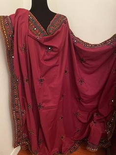 "Brand new without tags Balochi fully hand embroidered with mirror work Full size chaddar dupatta Size:92\"x 52\" inches  Color:Maroon Fabric:Cotton Silk ❌No Return Or Exchange❌ ➡️Feel free to message us if you need more pictures, measurements and details about the dress." Eid Traditional Nida Wear With Mirror Work, Traditional Nida Sharara With Mirror Work, Designer Dupatta With Dabka Work In Nida Fabric, Designer Dupatta With Dabka Work In Nida, Designer Nida Dupatta With Dabka Work, Mulmul Dupatta With Dabka Work In Traditional Drape, Festive Salwar Kameez With Mirror Work In Nida Fabric, Unstitched Chinon Dupatta With Dabka Work, Red Nida Salwar Kameez With Mirror Work