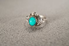 I am offering you this vintage sterling silver wedding band stacker design ring.  This features a raised relief  single stone setting.  This has a prong set oval shaped genuine Turquoise stone set in it.  This ring is currently a size 4, though I am sure it could be sized up or down. Please review all of my pictures, as they are all a very important part of , my listing/descriptions. Sterling Silver Wedding Band, Vintage Wedding Band, Single Stone, Stone Setting, Genuine Turquoise, Silver Wedding, Ring Sterling Silver, Stone Settings, Turquoise Stone