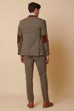 Inspired by old age country wear, the DX7 suit remains an ever so popular style, reminiscent of the 18th century. It is ideal for Autumn/Winter with its earthy colour palette and heavy fabric. A touch of modernism is added with a velvet contrast collar, elbow pads and pocket trims, nudging it back into the 21st century. Perfect for a rustic countryside wedding. Mix-and-match the waistcoat to differentiate from the groomsmen and match your accessories with the bridesmaid dresses. Looking for a pl Winter Fitted Tweed Three-piece Suit, Winter Tweed Three-piece Fitted Suit, Tailored Tweed Three-piece Suit For Winter, Winter Tailored Tweed Three-piece Suit, Winter Tweed Three-piece Suit, Fitted Brown Tweed Suits, Brown Fitted Tweed Suits, Fall Fitted Tweed Suits, Fall Tweed Fitted Suit