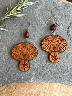 Hand stained wooden earrings paired with red tigerseye stones.  Stainless steel findings.  Please view second photo for size reference. Mushroom Earrings, Wooden Earrings, Jewelry Earrings Dangle, Dangle Drop Earrings, Stuffed Mushrooms, Dangle Earrings, Jewelry Earrings, Drop Earrings, Stainless Steel