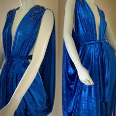 Handmade in our small exclusive studio in Portland Oregon. Indulge in the timeless elegance of our exquisite draped velvet Grecian gown, crafted from luxurious materials for a regal and goddess-like look.  The flowing design features intricate draping and a body-flattering silhouette, perfect for any formal occasion.  The soft rich crushed velvet  in a vibrant royal blue adds a touch of sophistication and luxury, while the Grecian-inspired details bring a touch of ancient glamour. Spectacular sparkling rhinestone appliqués on shoulders bring the bling for a one of a kind look!  This versatile gown can be worn in a number of different ways from a modest look to a more daring evening style. Pair with the matching turban, statement jewelry and heels for a look that's both dramatic and allurin Luxury Velvet Wedding Dress, Fitted Velvet Dress With Traditional Drape, Celtic Dresses, Grecian Gown, Celtic Dress, Velvet Evening Gown, Goddess Gown, Grecian Goddess, Evening Style