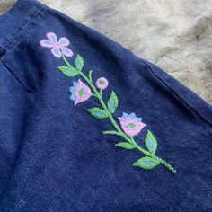 "60s 70s era true vintage dark blue denim shorts with embroidered floral details 🍒🌼 such a perfect pair of shorts we've had this in are archives for a minute and they need to be adored by someone special 🌼🍒 waist 29\" hips 38\" rise 12\" length 13\"" Vintage Embroidered Summer Bottoms, Denim Blue Cotton Bottoms With Floral Embroidery, Denim Blue Floral Embroidered Cotton Bottoms, Vintage Floral Embroidered Jeans For Spring, Cotton Jean Shorts With Floral Embroidery, Floral Embroidered Cotton Jean Shorts, Vintage Jean Shorts For Spring, Vintage Style Jean Shorts For Spring, Vintage High-waisted Jean Shorts For Spring