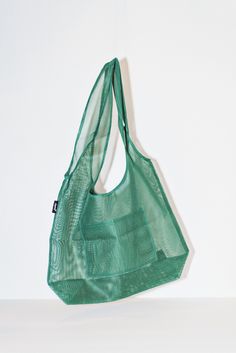 bio-knit body of bag: 20" W x 13.5" H /// with straps: 20" W x 28.5" H inside has two pockets to fit your keys, wallet, and phone Eco-friendly Green Shoulder Bag For On-the-go, Summer Green Shoulder Bag For On-the-go, Functional Green Bags For Everyday Use, Functional Green Bag For On-the-go, Functional Green On-the-go Bag, Green Nylon Shoulder Bag For On-the-go, Green Shoulder Bag With Pockets For Shopping, Everyday Green Nylon Shoulder Bag, Functional Green Bag With Removable Pouch