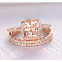 an engagement and wedding ring set with a princess cut peach morganite surrounded by pave diamonds