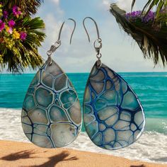 Adorn yourself with the beauty of nature-inspired elegance! Introducing our Bloom Art Earrings - a stunning fusion of vibrant fluid patterns captured on miniature canvases. Each pair is a unique masterpiece, showcasing the intricate, organic designs reminiscent of blooming flowers. 🌸 Handcrafted with precision and passion. 🌈 Vibrant colors to complement your style. 🎨 Miniature masterpieces for your ears. 🌟 Stand out with wearable art! Perfect for any occasion, our Bloom Art Earrings are more Artistic Adjustable Jewelry For Beach, Artistic Handmade Beach Jewelry, Artistic Design Drop Earrings, Multicolor Hand Painted Earrings For Beach, Unique Artistic Drop Earrings, Unique Teardrop Jewelry With Artistic Design, Artisan Teardrop Earrings With Artistic Design, Artisan Drop Earrings With Artistic Design, Artsy Blue Teardrop Earrings