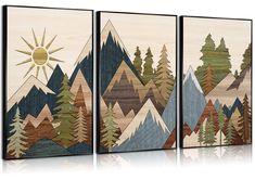 three wooden wall art pieces with mountains and trees painted on the sides, each depicting a sun