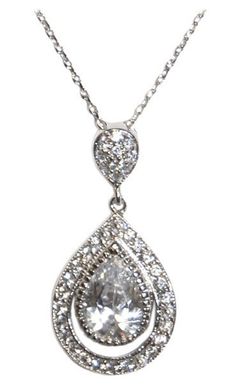 Delicate and dainty Swarovski crystal and cubic zirconia drop pendant necklace. A halo of stones surrounds the pear shaped center stone. The pendant measures 1" long and is .5" wide. The necklace is hanging from a dainty box style chain and measures 15.5"  - 17.5" including the chain extender. Price $48.00 Pear-shaped Necklace With Halo Setting For Wedding, Wedding Pear-shaped Necklace With Halo Setting, Pear-shaped Cubic Zirconia Drop Necklace In Diamond White, Teardrop Cubic Zirconia Necklace With Rhinestones, Pear-shaped Cubic Zirconia Drop Necklace For Anniversary, Teardrop Pendant Necklace With Halo Setting For Wedding, Teardrop Cubic Zirconia Necklace For Anniversary, Silver Cubic Zirconia Pear-shaped Drop Necklace, Cubic Zirconia Teardrop Pendant Necklace With Sparkling Stones