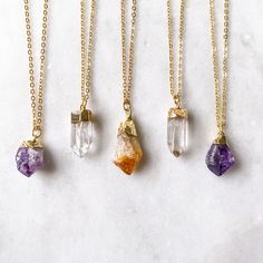 These dainty crystal necklaces are made with REAL crystal points in an easy to wear, mini size. Each stone measures approximately 0.75 inch - 1.00 inch in length. Crystal options are: Amethyst (untreated) Quartz (untreated) Citrine (heat treated) Would be great for layering and everyday wear. Metal options are gold plated brass or silver plated brass. Necklace Birthstone, Stone Pendant Necklace, Silver Plated Necklace, Christmas Gift Jewelry, Amethyst Necklace, Birthstone Necklace, Stone Pendant, Quartz Stone, Buying Jewelry