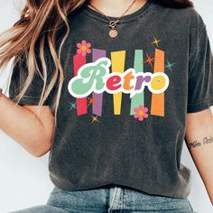 This t-shirt is everything you've been dreaming of! Soft, lightweight, and with just the right amount of stretch, it's designed to be comfortable and flattering for everyone. Ideal for women's clothing, this retro graphic tee is perfect as a unique gift for her, whether for your daughter, mom, or as a big sister gift. 100% combed and ring-spun cotton (Heather colors contain polyester) Fabric weight: 4.2 oz./yd.² (142 g/m²) Pre-shrunk fabric Side-seamed construction Shoulder-to-shoulder taping Et Women 70s, 70s Women Fashion, Big Sister Gifts, Retro Graphic Tees, Tshirt Women, Retro Tops, 70s Style, Retro Women, Unique Gifts For Her