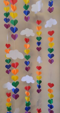 colorful paper hearts and clouds hanging from the ceiling