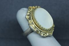 "Whiting & Davis Mother of Pearl Ring Classic 1970s era signed Whiting and Davis Victorian style ring featuring Mother of Pearl set in ornate gold tone. Ring is fully hallmarked and will arrive gift boxed. * HALLMARKS Whiting and Davis mark. * SIZE 5, face of ring measures 1 1/8\" wide north and south on finger. * CONDITION In very good condition. Please use pictures as part of item's description. * MATERIALS Mother of Pearl, gold tone." Victorian Gold Engraved Collectible Ring, Vintage Filigree Ring For Anniversary, Ornate Cameo Jewelry For Anniversary, Vintage Engraved Ring With 17 Jewels For Anniversary, Victorian Gold Engraved Ring, Victorian Style Gold Engraved Ring, Vintage Gold Metal Rings, Victorian Cabochon Wedding Rings, Elegant Brass Rings With Cabochon