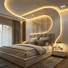 a bed room with a neatly made bed and a round mirror above the headboard