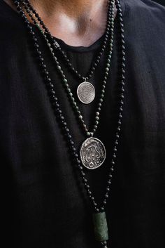 This vintage Tibetan Padma amulet evokes a feeling of an ancient culture, coupled with a modern edge! It is masterfully crafted with a hand-knotted lava stone & silver necklace. The lava stone chain is 57 cm long [app 22.5 in long] Spiritual Necklaces With Oxidized Finish For Meditation, Artisan Hand Knotted Necklaces For Meditation, Artisan Hand Knotted Necklace For Meditation, Artisan Medallion Necklace For Meditation, Bohemian Black Hand Knotted Jewelry, Silver Pendant Beaded Necklace For Meditation, Black Spiritual Necklace With Coin Pendant, Bohemian Silver Hand Knotted Jewelry, Silver Hand Knotted Adjustable Necklace