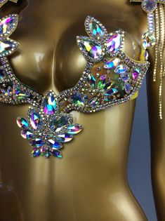 a close up of a mannequin with jewels on it