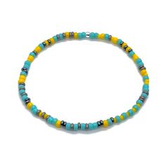 Shiny and matte glass seed beads; silver-tone & gunmetal glass seed bead disks; stainless steel grooved tube bead; finished with sterling silver beads. Stretch style. Waterproof. Perfect solo or stacked. Bracelets Sets, Yellow Turquoise, Men's Bracelet, Bead Bracelets, Seed Bead Bracelets, Tube Beads, Ring Size Guide, Bracelet Stack, Sterling Silver Bead