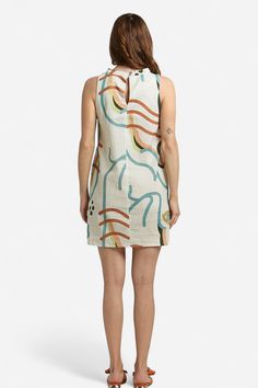 Elevate your summer wardrobe with our Camilla Abstract Print Linen Mini Dress! Made with lightweight linen, it features a high neckline, sleeveless silhouette, and convenient side-seam pockets. Pair it with our Zoe Orange Bow sandals for a casual day look or dress it up with heels for a chic night-time ensemble. Embrace the warm weather in style and comfort with this versatile piece. Made in Italy by BravaaComposition:100% LinenFit:Model 1 is wearing a size Small. Model's measurements: Height 5' High Neck Sleeveless Dress For Summer, High Neck Beige Dress For Summer, Unlined Linen Dress For Day Out, Beige High Neck Dress For Summer, Beige High Neck Summer Dress, Casual High Neck Mini Dress For Summer, Summer High Neck Beige Dress, High Neck Mini Dress For Summer Beach, Summer High Neck Mini Dress For Beach