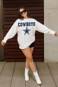 Bring the energy of the game to your wardrobe with our Dallas Cowboys oversized long sleeve tee with ribbed neckline and cuffs. Showing off your Dallas Cowboys spirit will be a breeze. Dallas Cowboy Outfits Woman, Varsity Long Sleeve T-shirt For Game Day, White Oversized Varsity Sweatshirt, Oversized White Varsity Sweatshirt, Oversized Collegiate Long Sleeve Top, Oversized Long Sleeve Collegiate Tops, College Style Long Sleeve Tops For Sports Season, School Spirit Long Sleeve T-shirt For Game Day, Long Sleeve T-shirt For Game Day With School Spirit