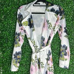 Floral Printed Trench Jacket With Open Front, Notch Collar, Belted Waist, Vent At Back, And Roll Up Sleeves Content: 95% Polyester 5% Spandex Never Worn Wrinkle From Storage Size Medium White Open Front Outerwear For Work, White Collared Outerwear For Day Out, White Floral Print Outerwear For Fall, White Fall Outerwear For Brunch, White Lapel Collar Summer Outerwear, White Summer Outerwear With Lapel Collar, White Lapel Collar Outerwear For Summer, Fitted Long Sleeve Floral Print Outerwear, Fitted Floral Print Long Sleeve Outerwear