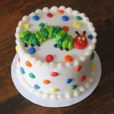 a birthday cake decorated with the very hungry caterpillar on it's side