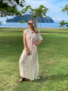 Whether you will wear it as an over-bikini cover-up, or as a dress on its own, you will be able to achieve an elevated look with our Collette Kaftan. Delicate and sophisticated, this linen kaftan will be a perfect fit at a resort by the sea, or at any poolside setting. You can also wear it as a tunic over a slip dress, shorts and even jeans. Collette Kaftan is one size. Due to its breathable transparency, you can purchase it together with our Leah cotton slip dress, that is available in sizes S,