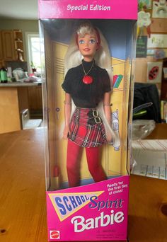 the barbie doll is in its box on the table