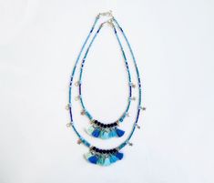 Spice up your Summer with unique tassel necklace in blue shades, with a carefree bohemian vibe. Made with Turquoise and Marble stones, navy blue ruberized beads, silver plated star charms, glass beads and tiny handmade cotton tassels. ►Pick between four lengths, wear two necklaces for a statement layered look or a single strand as an accent. ►Length Options: 18/20/25/27inches. Modeled necklaces are: Short necklace is 18 inches long (45cm). The longer necklace is 25 inches long (63cm). Message me Adjustable Fringe Necklace For Beach, Bohemian Turquoise Necklaces With Tassels, Bohemian Beach Tassel Necklace With Fringe, Adjustable Turquoise Tassel Necklaces, Turquoise Tassel Necklaces For Festivals, Blue Hippie Necklaces For Festivals, Blue Hippie Necklace For Festivals, Blue Tassel Necklace For Beach, Hippie Blue Necklaces For Festivals