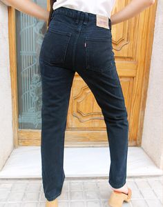 501 Levis jeans in black. Button fly. Front and back pockets.Available sizes: 30" waist UK 12 / EU 40 Actual measurements - 30"(76cm) waist - 36"(92cm) hips - 30"(76cm) inner leg - 10.5"(27cm). 31" waist - tall UK 12-14 / EU 40-42 Actual measurements - 31"(79cm) waist - 36"(92cm) hips - 32"(82cm) inner leg - 12"(30cm) rise. 31" waist UK 12-14 / EU 40-42 Actual measurements - 31"(79cm) waist - 40"(102cm) hips - 30"(76cm) inner leg - 12"(30cm) rise. 32" waist UK 14 / EU 42. Actual measurements - 3 Levis Jeans 501, Womens Levi Jeans, Levis 501 Black, Vintage Levis Jeans, Jumpsuit Skirt, Levi Jeans 501, Sleeveless Jacket, Lee Jeans, Levis 501