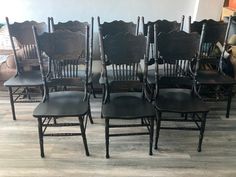 a bunch of chairs that are sitting next to each other on the floor in a room