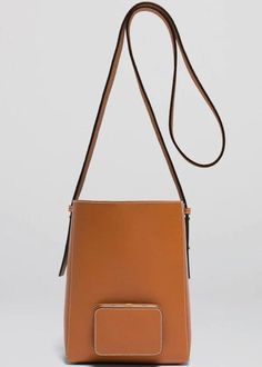 The Lutz Morris Parker M Soft in Tan is the ideal everyday bag for those on the go. With a spacious yet soft construction, it can easily fit all of your daily essentials. The adjustable strap and 24k gold-plated stainless steel frame make it comfortable to wear cross-body or on the shoulder. Additionally, the outside pocket features two leather slots to keep your cards, cash, and other essentials secure. Available in Tan Gold-rated smooth calf leather, tanned in Germany Frame is 24k gold-plated Luxury Tan Shoulder Bag For On-the-go, Luxury Tan Shoulder Bag For Everyday, Designer Gold Bucket Bag For Everyday Use, Modern Tan Shoulder Bag With Adjustable Strap, Modern Gold Bucket Bag For Everyday, Modern Gold Bucket Bag With Detachable Strap, Modern Gold Rectangular Bucket Bag, Tan Rectangular Bucket Bag With Detachable Strap, Modern Gold Bucket Bag For Everyday Use