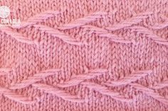 pink knitted fabric with wavy lines on it