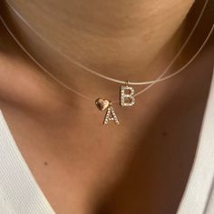 "Personalized Invisible Cord Necklace, Initial Clear Cord, Dainty Name necklace, Gift for Girlfriend, Minimal Layering Necklace, Zirconia Gemstone Letter Necklace, Trendy Girlfriend Necklace, Nylon Cord, Tiny Letter, 925, Trendy 925 Sterling Silver Jewelry Pure 925 Sterling Silver Gold & Rose Gold & Rhodium Plated Cz Stone / Zirconia Gemstone Block Letter Hypoallergenic, Nickel-free This Product Requires 1-2 weeks to be Produced 16\" Clear Cord Chain - Send me a message if you need different len Elegant Name Pendant Chain Necklace, Minimalist Name Necklace With Cable Chain As Gift, Initial Pendant Name Necklace With Delicate Chain, Clear Pendant Necklaces For Anniversary, Valentine's Day Clear Jewelry For Party, Elegant Clear Necklaces For Valentine's Day, Elegant Clear Necklace For Valentine's Day, Gold Initial Pendant Name Necklace With Cable Chain, Elegant Clear Heart Shaped Necklace