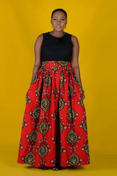 "African wax maxi skirt is a beautiful, statement piece. It is full and generously made. There is zip at the back of the skirt for convenience. This skirt is perfect for all occasions, be sure you will be getting lots of compliments wherever you wear it to. Product Details 100% African wax cotton Lenght 45\" Zipper at the back of skirt Also available in other prints Care instructions: Hand wash cold Do not bleach Chat Us up via etsy conversation if you have any question" Pleated And Flowy Full Skirt Maxi Dress, Flowy Maxi Dress With Gathered Skirt, Bohemian Long Pleated Maxi Skirt, Red Long Pleated Skirt Dresses, Voluminous Maxi Dress With Lined Skirt, Voluminous Lined Maxi Dress, Red Long Pleated Dress, Bohemian Full Pleated Skirt Dress, Relaxed Fit Pleated Maxi Dress